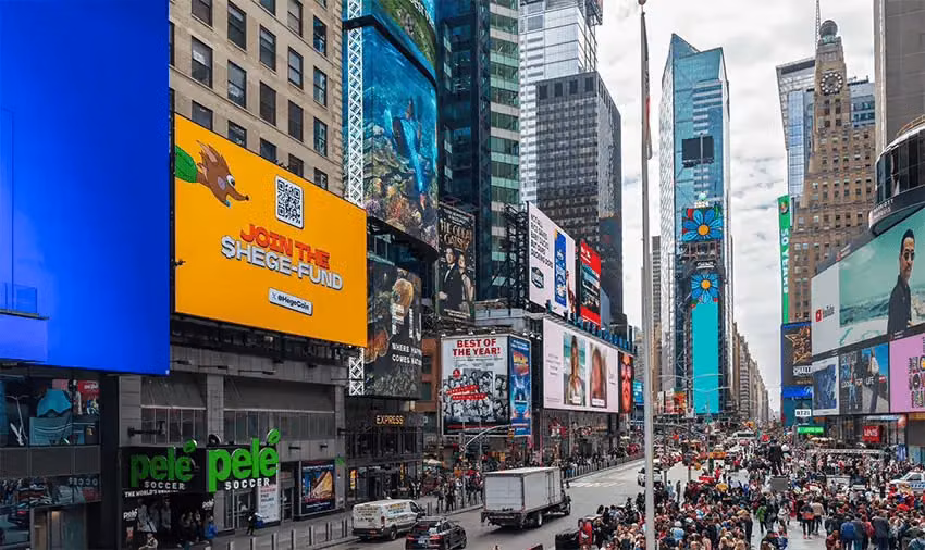 Billboard in Times Square, New York City, showing a Hege ad.